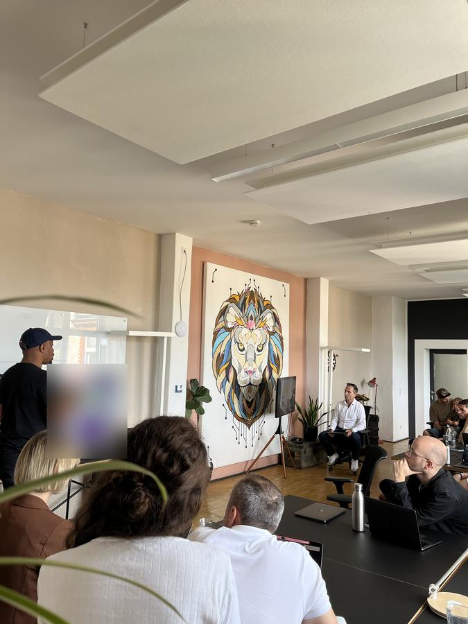 Okey running an account-based marketing session for the sales team at an office in Berlin